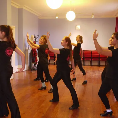 Tap class rehearsing a routine in the Harlow dance studio