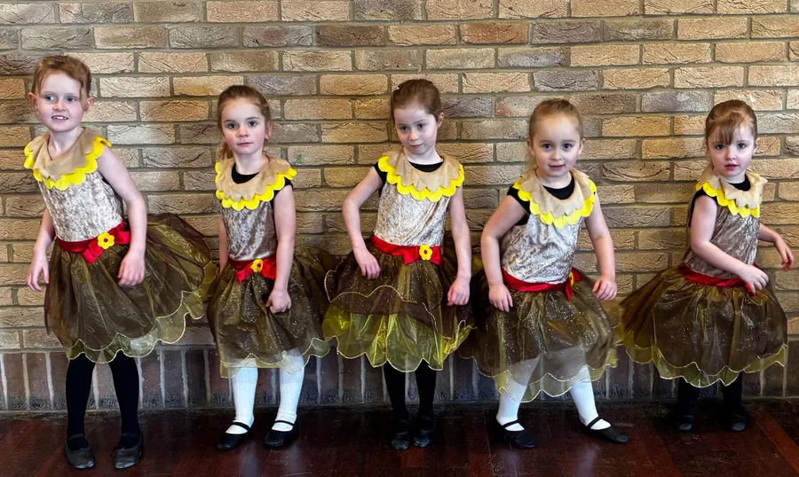 Pre-school pupils in gold flower costumes at Karen Chapman School of Dancing in Harlow