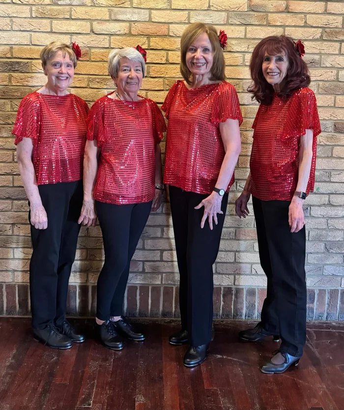 Adult tap class members in red sequinned tops at Karen Chapman School of Dancing in Harlow